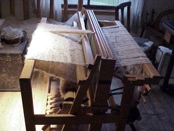 one of the side panels being woven